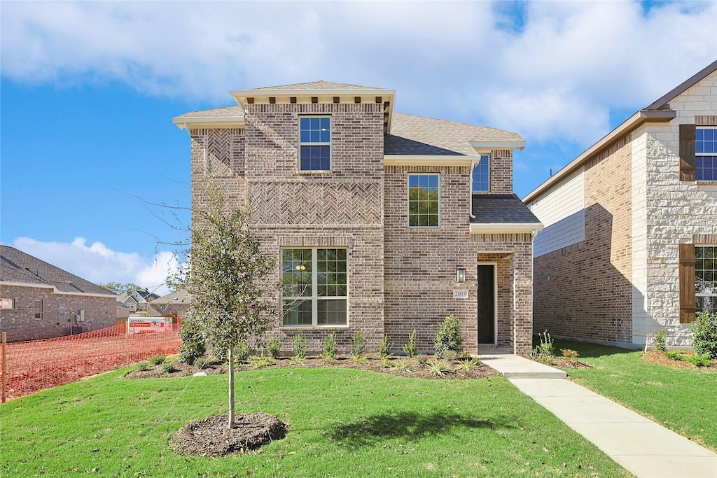 view of front of house with a front lawn