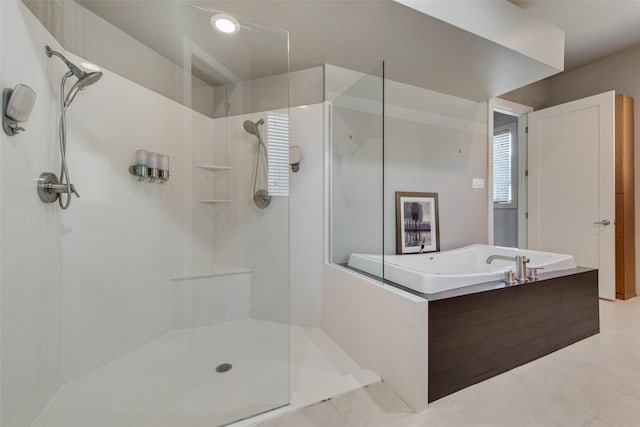 bathroom featuring tile patterned floors and plus walk in shower