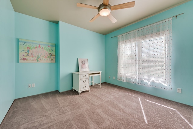 unfurnished bedroom featuring ceiling fan and light carpet