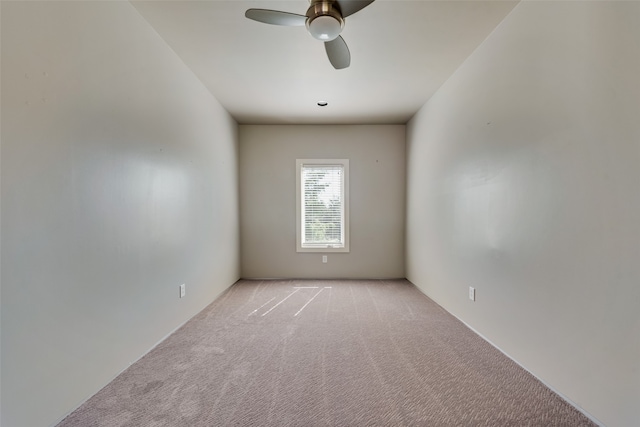 spare room with light carpet and ceiling fan