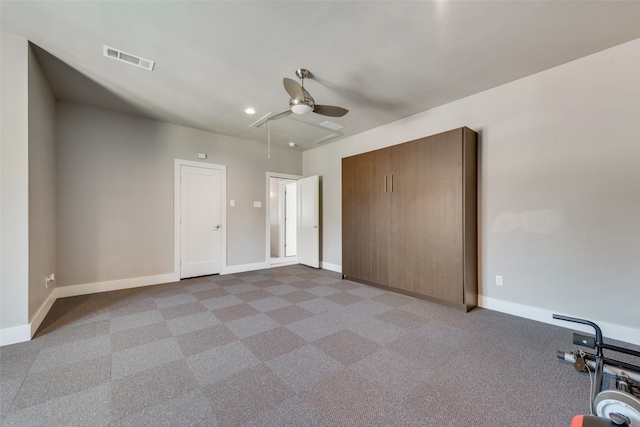 unfurnished bedroom featuring ceiling fan