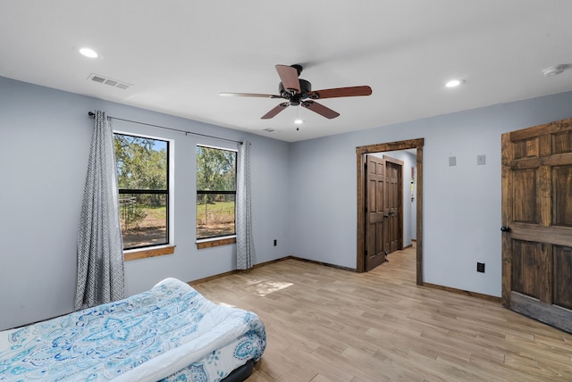 bedroom featuring ceiling fan and light hardwood / wood-style floors