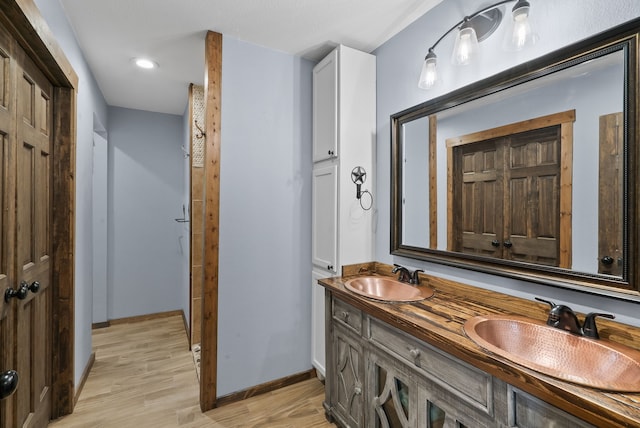 bathroom featuring vanity and hardwood / wood-style floors