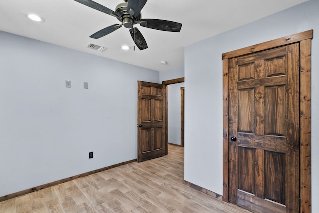 unfurnished bedroom featuring ceiling fan and light hardwood / wood-style flooring