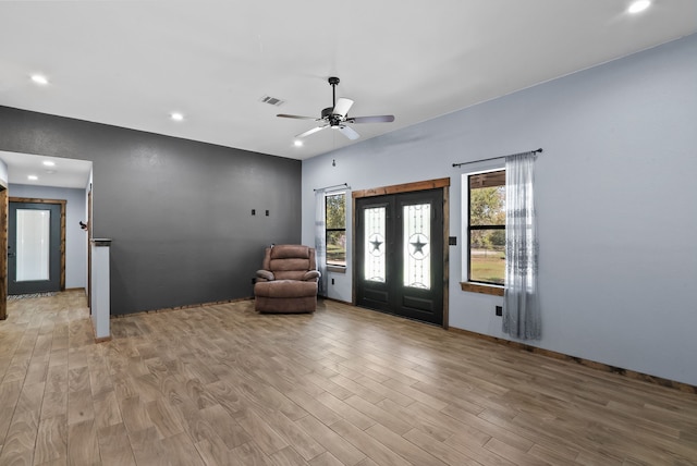 entryway with plenty of natural light, ceiling fan, light wood-type flooring, and french doors