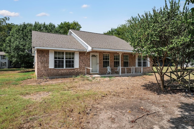 ranch-style home featuring a front yard