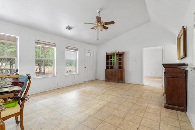 living room featuring ceiling fan, lofted ceiling, and a healthy amount of sunlight