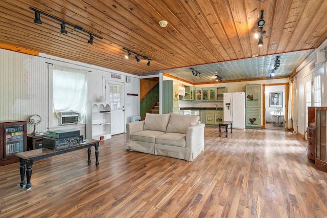 living room with a wealth of natural light, hardwood / wood-style flooring, wooden ceiling, and rail lighting