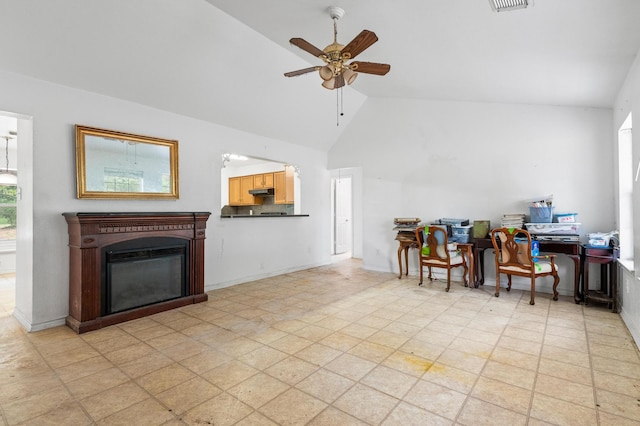 office featuring ceiling fan, light tile patterned floors, and high vaulted ceiling