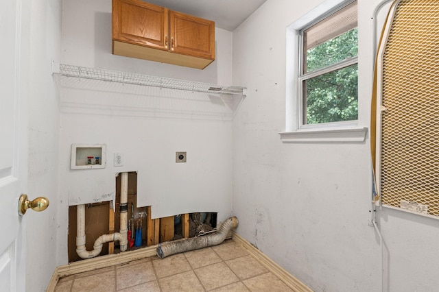 laundry room with cabinets, hookup for an electric dryer, and hookup for a washing machine