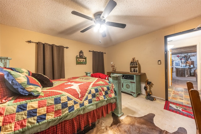 bedroom with a textured ceiling and ceiling fan