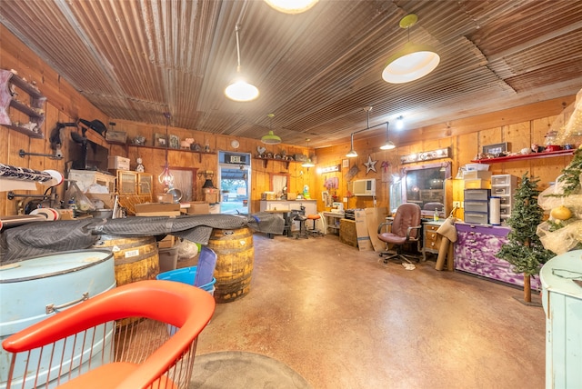 garage featuring wooden walls