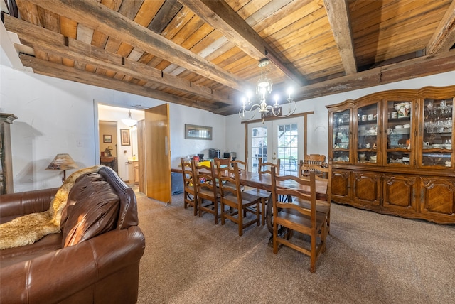 dining area with french doors, beam ceiling, wooden ceiling, and carpet floors