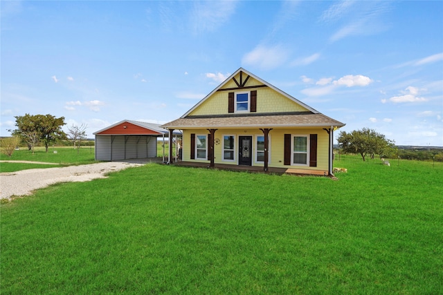 view of front of house featuring a front lawn, a carport, and a porch