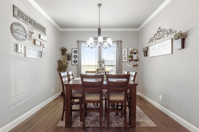 dining space featuring ornamental molding, dark hardwood / wood-style flooring, and a chandelier