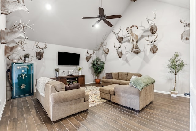 living room with vaulted ceiling, ceiling fan, and hardwood / wood-style flooring