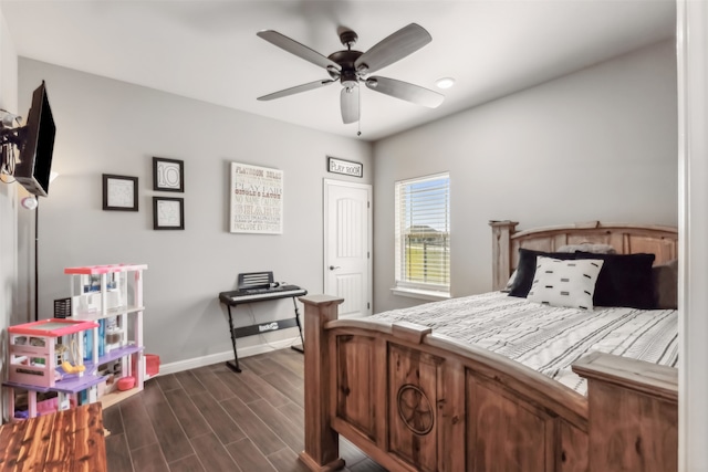 bedroom with ceiling fan and dark hardwood / wood-style floors