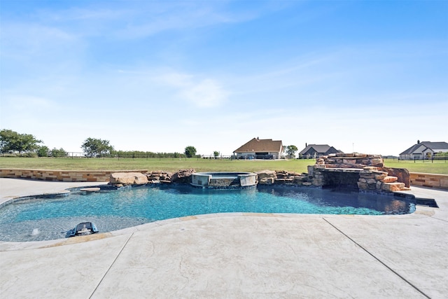 view of pool with a patio, an in ground hot tub, and a yard