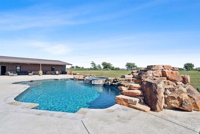 view of pool with a patio and an in ground hot tub