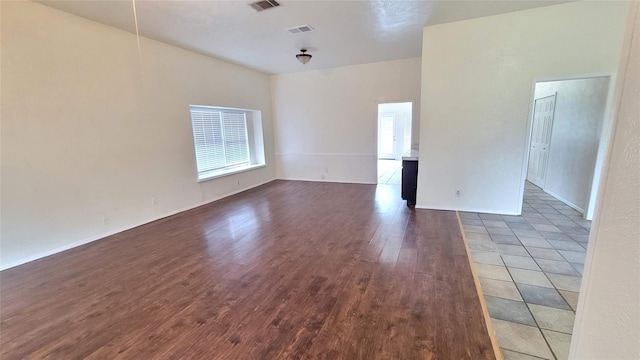 empty room with hardwood / wood-style floors