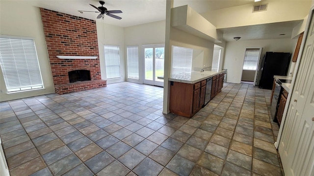 kitchen with a fireplace, dishwashing machine, electric stove, and ceiling fan