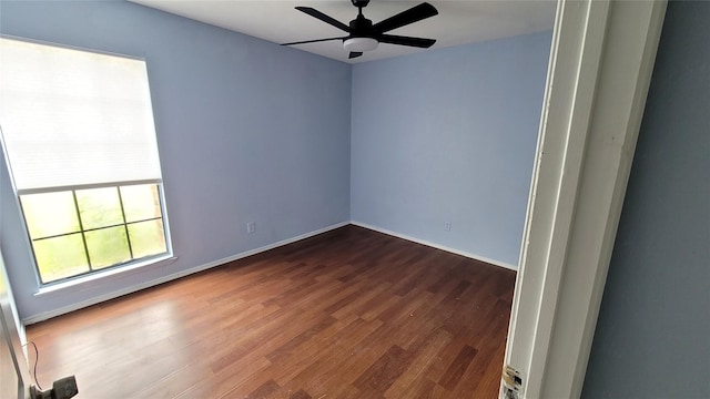 spare room with hardwood / wood-style flooring and ceiling fan