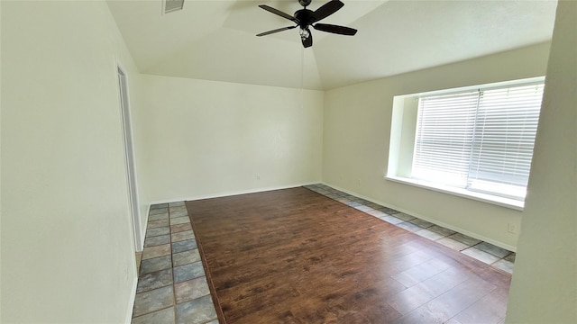 unfurnished room featuring lofted ceiling and ceiling fan