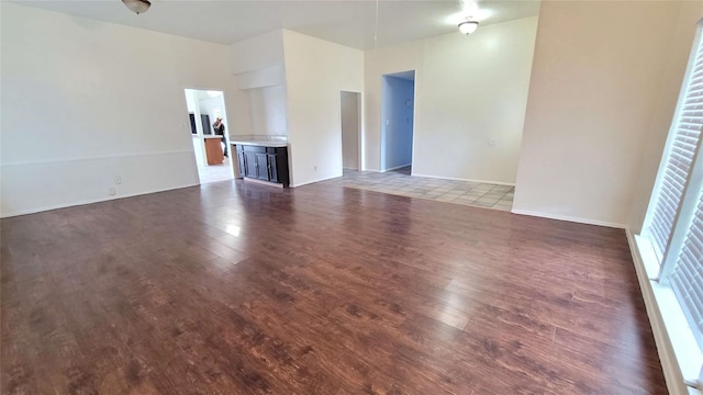 unfurnished living room featuring hardwood / wood-style flooring