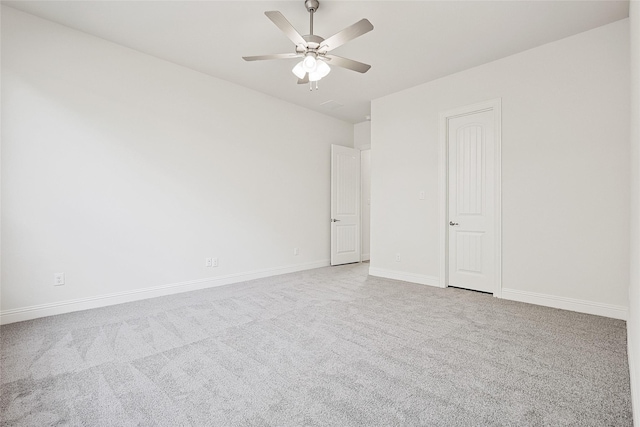 empty room featuring light carpet and ceiling fan