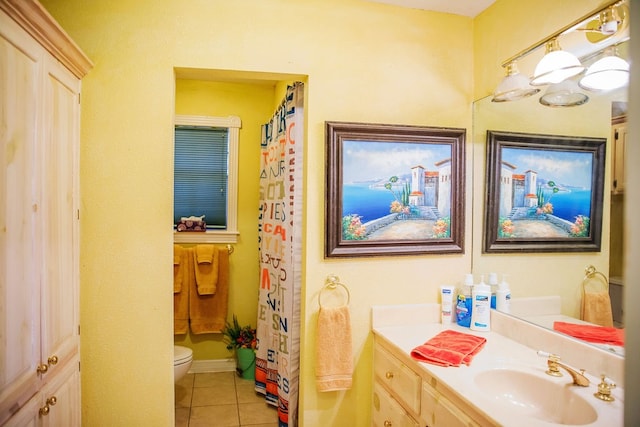 bathroom featuring vanity, toilet, a shower with shower curtain, and tile patterned flooring