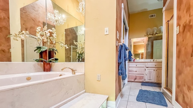 bathroom featuring tile patterned flooring, shower with separate bathtub, and vanity