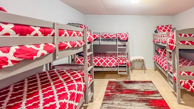 bedroom with light tile patterned floors