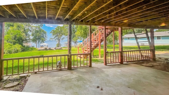 view of patio with a water view