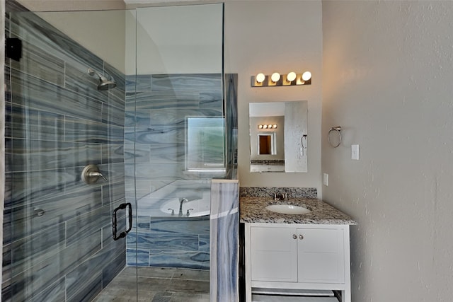 bathroom featuring vanity and separate shower and tub