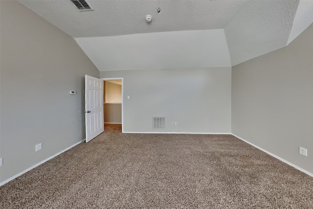 bonus room with a textured ceiling, carpet, and vaulted ceiling