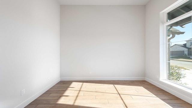 spare room with light hardwood / wood-style flooring