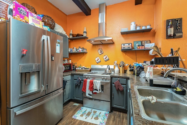 kitchen with wall chimney range hood, appliances with stainless steel finishes, sink, dark wood-type flooring, and beamed ceiling