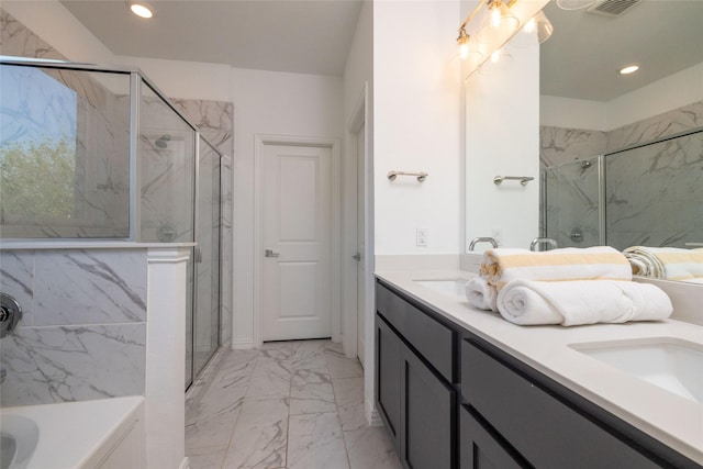 bathroom featuring vanity and separate shower and tub