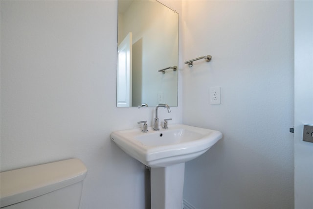 bathroom with toilet and sink