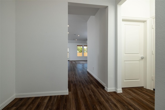 hall with dark hardwood / wood-style floors