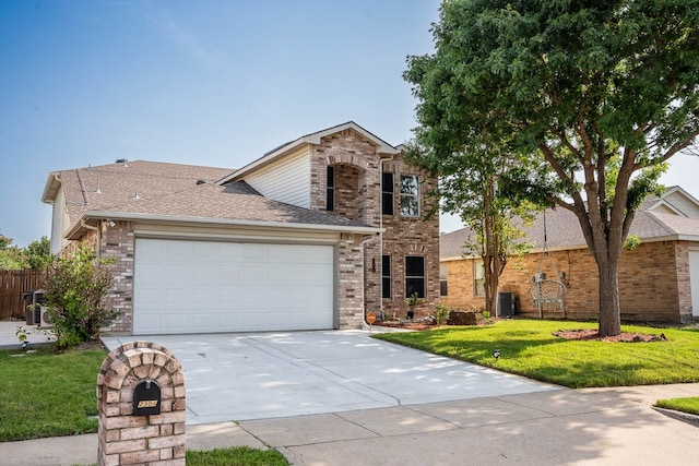 view of front of property with a front yard and central AC unit