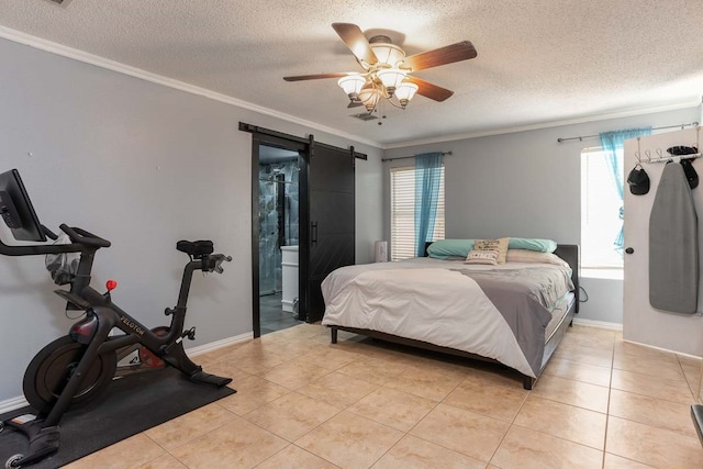 tiled bedroom with a textured ceiling, crown molding, connected bathroom, a barn door, and ceiling fan