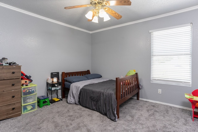 carpeted bedroom with ceiling fan, crown molding, and a textured ceiling