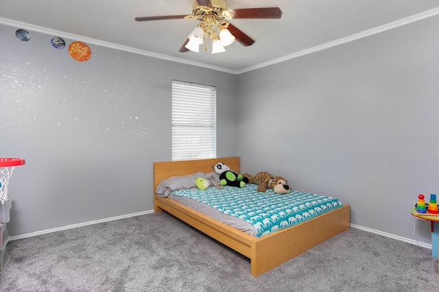 bedroom featuring ceiling fan, crown molding, and carpet floors