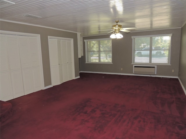 unfurnished bedroom featuring ceiling fan, ornamental molding, a wall unit AC, and multiple windows