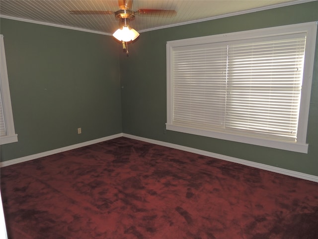 empty room with carpet flooring, ceiling fan, and ornamental molding