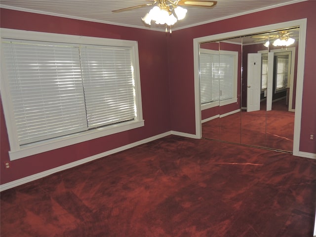 spare room featuring ceiling fan, carpet floors, and ornamental molding