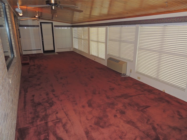 interior space with wooden ceiling, an AC wall unit, vaulted ceiling, carpet flooring, and ceiling fan