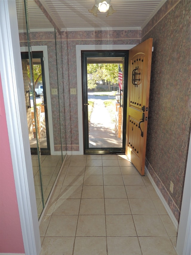 doorway with light tile patterned floors