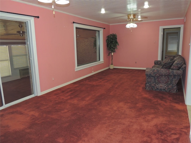 unfurnished room featuring dark colored carpet and ornamental molding